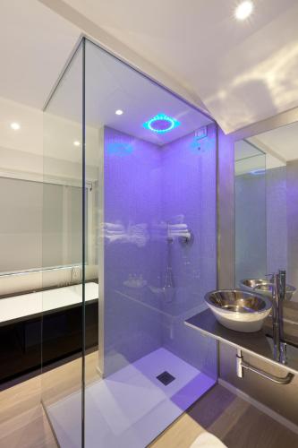 a bathroom with a glass shower with a sink at Hotel Ca' Di Valle in Cavallino-Treporti