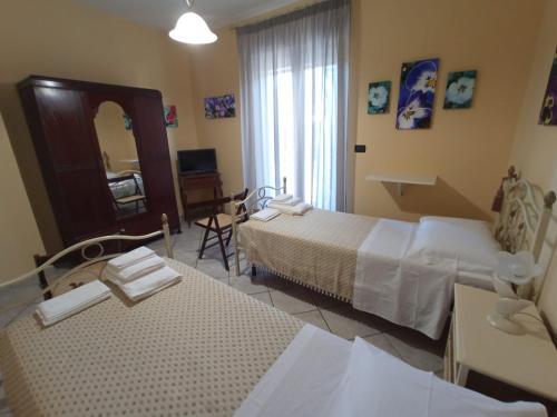 Postel nebo postele na pokoji v ubytování I Fiori di AminA