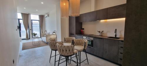 a kitchen with four chairs and a table in it at MD Pare Presentat in Valencia