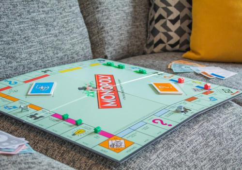 a board game sitting on a couch at 10 Bynack House in Aviemore
