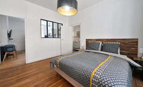 Katil atau katil-katil dalam bilik di 3 Appartements Premium au pied de la Cathédrale - Hypercentre