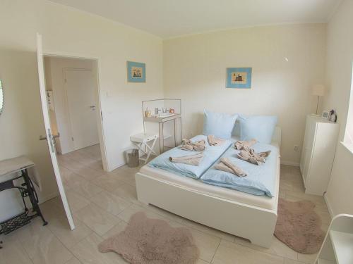 Кровать или кровати в номере Ferienhaus Barbara, FeWo Vermittlung Nordsee