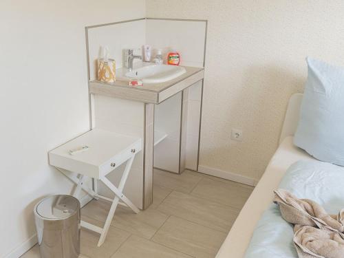 Кровать или кровати в номере Ferienhaus Barbara, FeWo Vermittlung Nordsee
