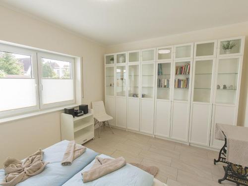 Кровать или кровати в номере Ferienhaus Barbara, FeWo Vermittlung Nordsee