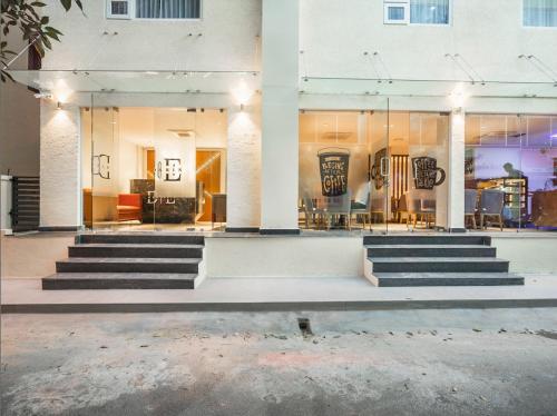 a building with stairs in front of a building at De Mandarin in Bangalore