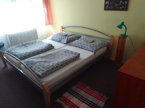 two beds sitting next to each other in a bedroom at Chata Nová Huť in Nové Hutě