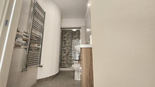 a bathroom with a toilet and a sink at Perla Suite in Mesagne