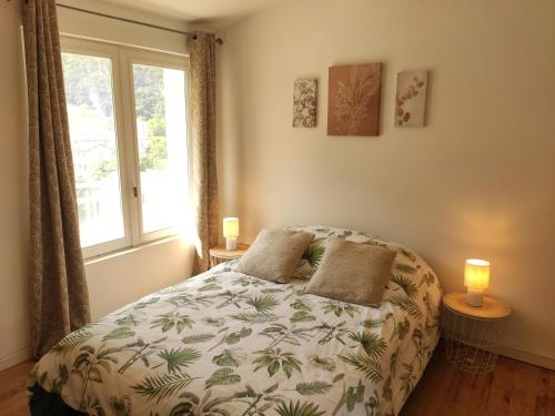 a bedroom with a bed and a window at Le Comte Fébus - Focalimmo in Foix