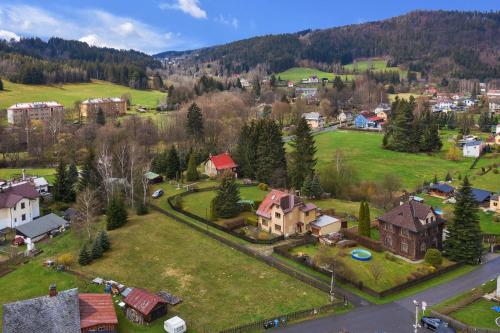 an aerial view of a village with houses and trees at Chata Horal in Tanvald