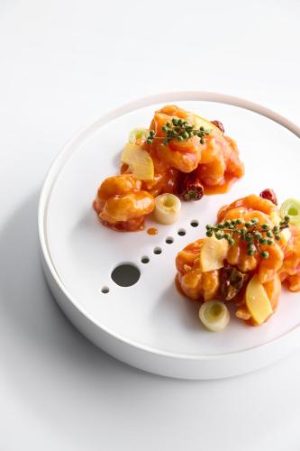 a white plate of food on a white plate at Le Meridien Xi'an Chanba in Xi'an