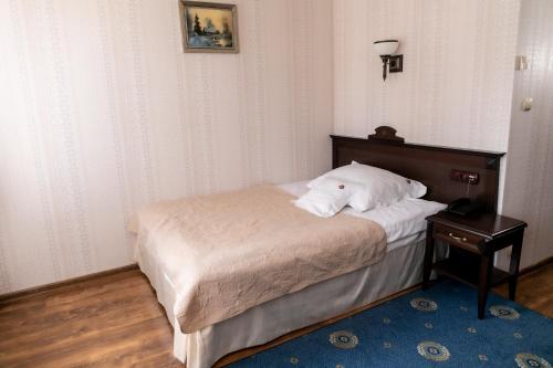 Postel nebo postele na pokoji v ubytování Oławian Hotel