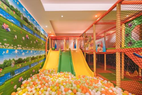 a childrens play area with a slide and balls at Welcomhotel by ITC Hotels, Shimla in Shimla