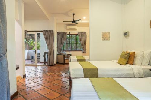 Postel nebo postele na pokoji v ubytování Pavillon Indochine Boutique - Hotel