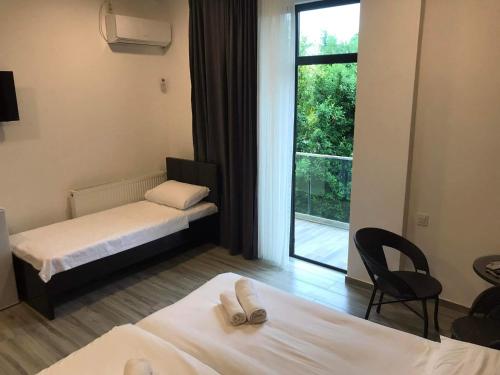 Postel nebo postele na pokoji v ubytování Hotel Niko