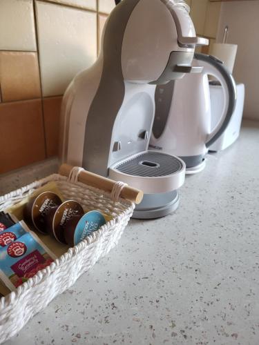 a mixer sitting on a kitchen counter with a basket at Penzion Kostelany in Kostelany