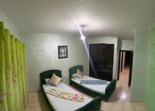 Cama o camas de una habitación en Appartement AP2 Résidence Al Waha