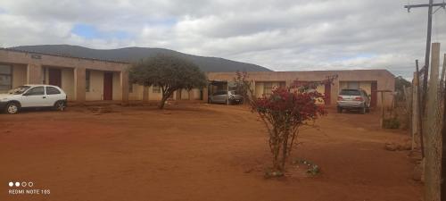 a group of cars parked in front of a building at Nakedi Accommodation Services in Burgersfort