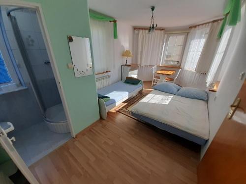 a small room with a bed and a couch at Agroturystyka Relaks in Orzeszkowo