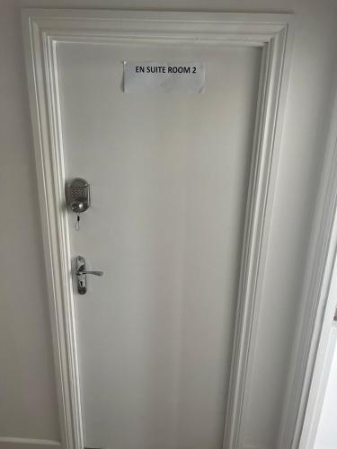 a door with a sign that reads exit suite room at Starlet Property in Wanstead