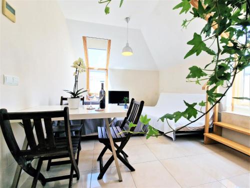 a dining room with a table and chairs at AA Guest - Salinas Paradise Terrace Eco Apartment in Fuengirola