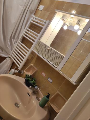 a bathroom with a sink and a mirror at by Domy in Ostuni