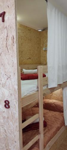 Ένα ή περισσότερα κρεβάτια σε δωμάτιο στο HOSTEL NAMOR