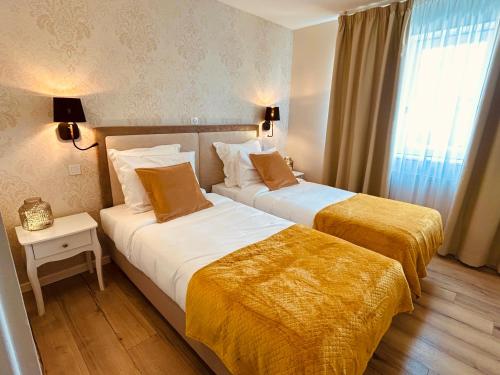 Ένα ή περισσότερα κρεβάτια σε δωμάτιο στο Le Royal Picardie