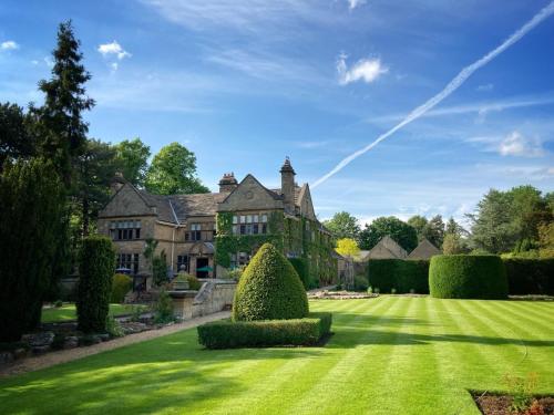 an estate with a lawn and a house at Fischers Baslow Hall - Chatsworth in Baslow