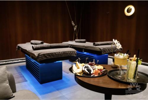a room with three beds and a table with food on it at The Arkin Iskele in Iskele