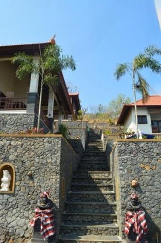 a set of stairs leading up to a building at Shankara Parada Villas in Amed