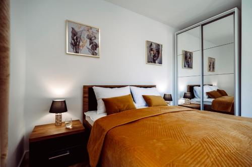 Ένα ή περισσότερα κρεβάτια σε δωμάτιο στο Apartamenty In Belnihel