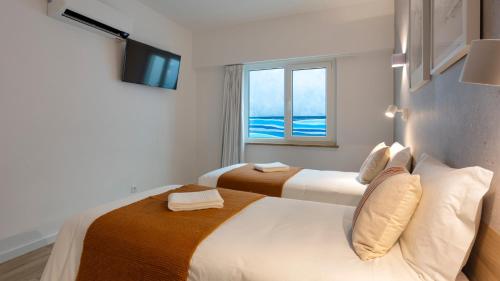 Un ou plusieurs lits dans un hébergement de l'établissement Hotel Made inn Faro
