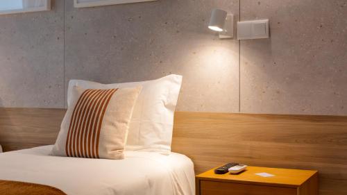Un ou plusieurs lits dans un hébergement de l'établissement Hotel Made inn Faro
