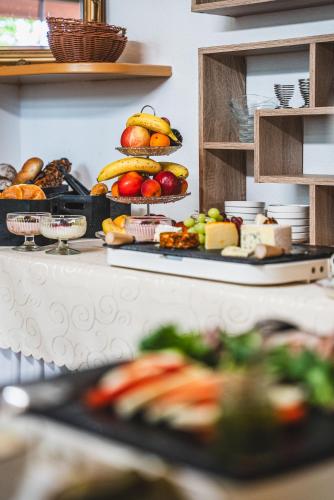 a buffet with different types of fruits and vegetables at Hotel Kärntnerhof Velden by S4Y in Velden am Wörthersee