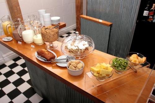 a table with food and other food items on it at Hotel Ultramar in Valparaíso
