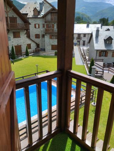a view from the balcony of a resort with a pool at El rincón de Benás in Anciles