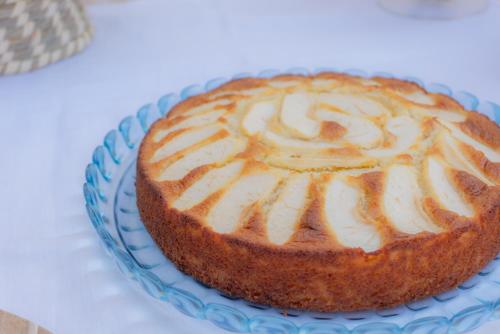 a cake on a blue plate on a table at RUDINI' CHARMING ROOM in Marzamemi