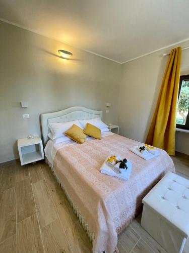 a bedroom with a bed with two dolls on it at B&B La Limonaia in Tollo