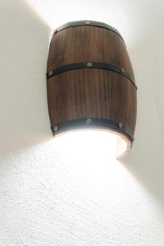 a wooden light on the side of a wall at RUDINI' CHARMING ROOM in Marzamemi