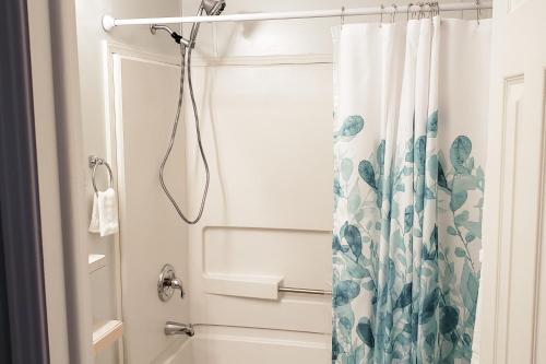 a bathroom with a shower with a shower curtain at Country Quiet in Sanford