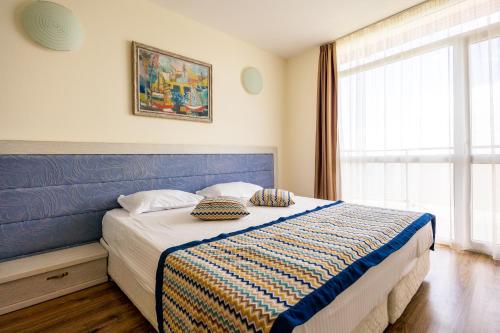 Postel nebo postele na pokoji v ubytování Royal Bay Resort & Aqua Park - All Inclusive and Free beach accsess