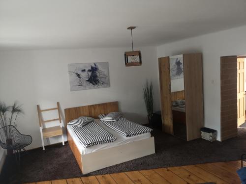 a bedroom with a bed and a mirror at NEUSTADT Villa in Braşov