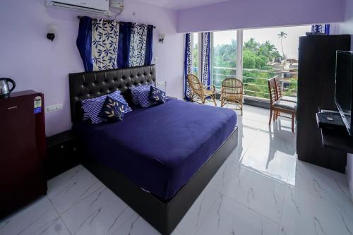 Un pat sau paturi într-o cameră la Swati