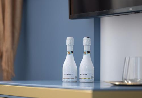 two bottles of wine sitting on a table at Acropol Golden Suites in Neos Marmaras