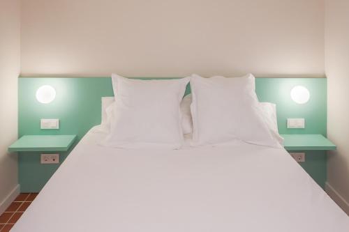 Letto o letti in una camera di Terra Aurea Aparthotel