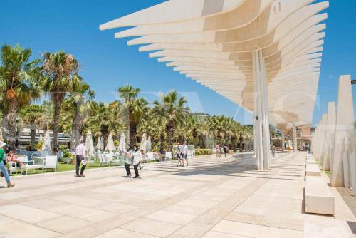 a rendering of a plaza with palm trees at Deluxe Apartment - Historic Center by REMS in Málaga