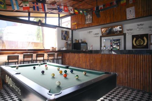 a pool table in a room with a bar at Tropical Village Resort in Koh Samui 
