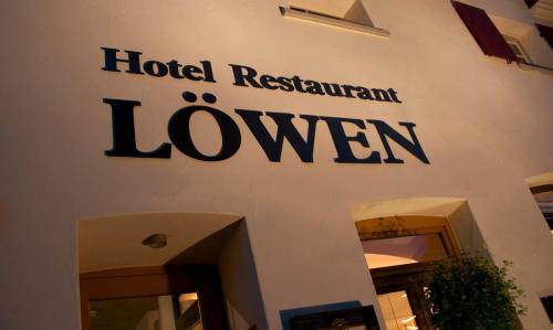 a sign on the side of a hotel restaurantlove sign at Design Hotel & Restaurant Löwen in Ulm