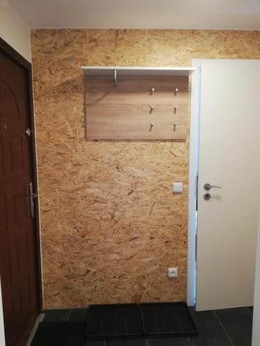 a room with a wall with a window and a shutter at Chalupa U Potoka in Říčky