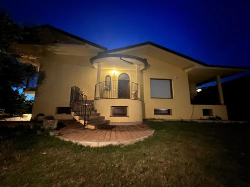 a house at night with the lights on at Villa MA-YA in Santa Maria Imbaro